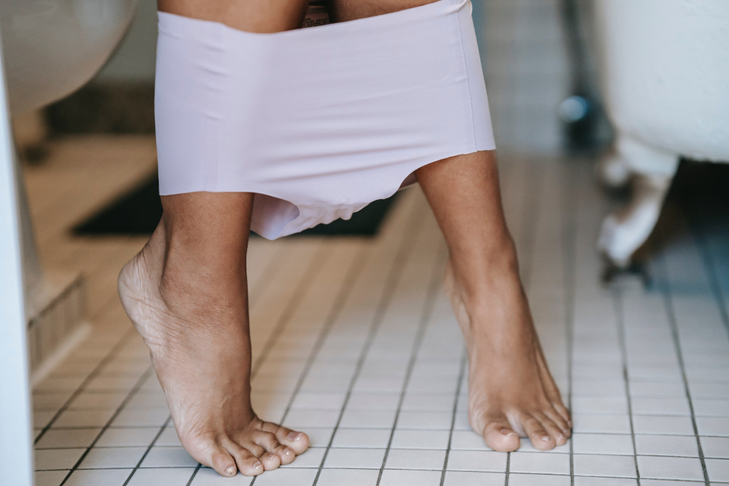 legs and feet with underpants around the ankles