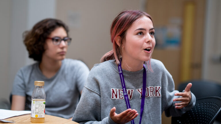 photo of a young person speaking enthusiastically in a Brook workshop