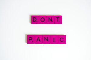 letter tiles spelling out "Don't panic"