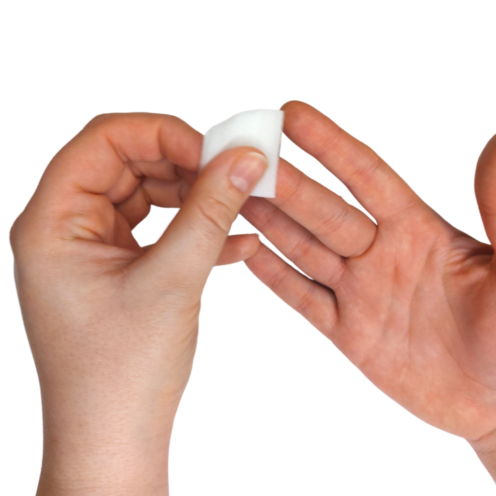 Using a cleansing wipe to clean the finger that the lancet will prick.