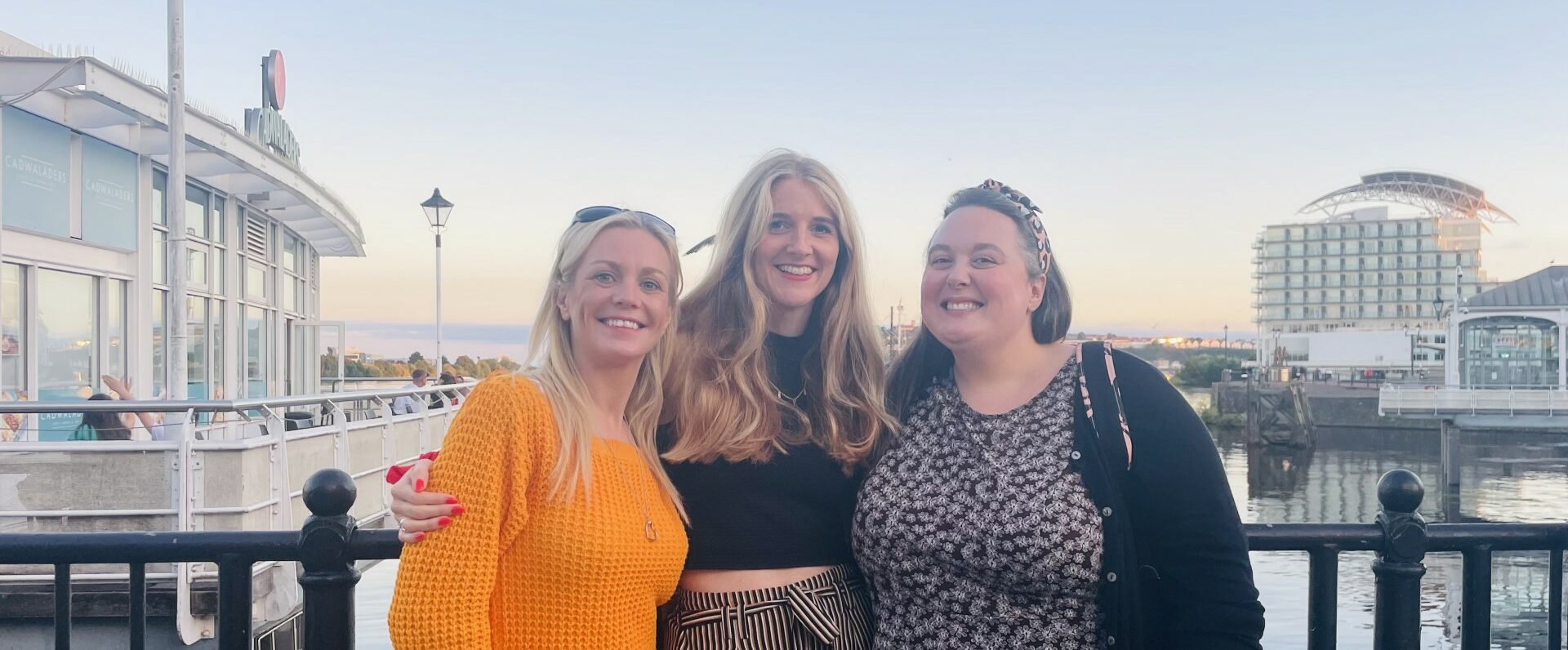 Julie-Anne, Sarah and Kelly stood together in front of cardiff harbour