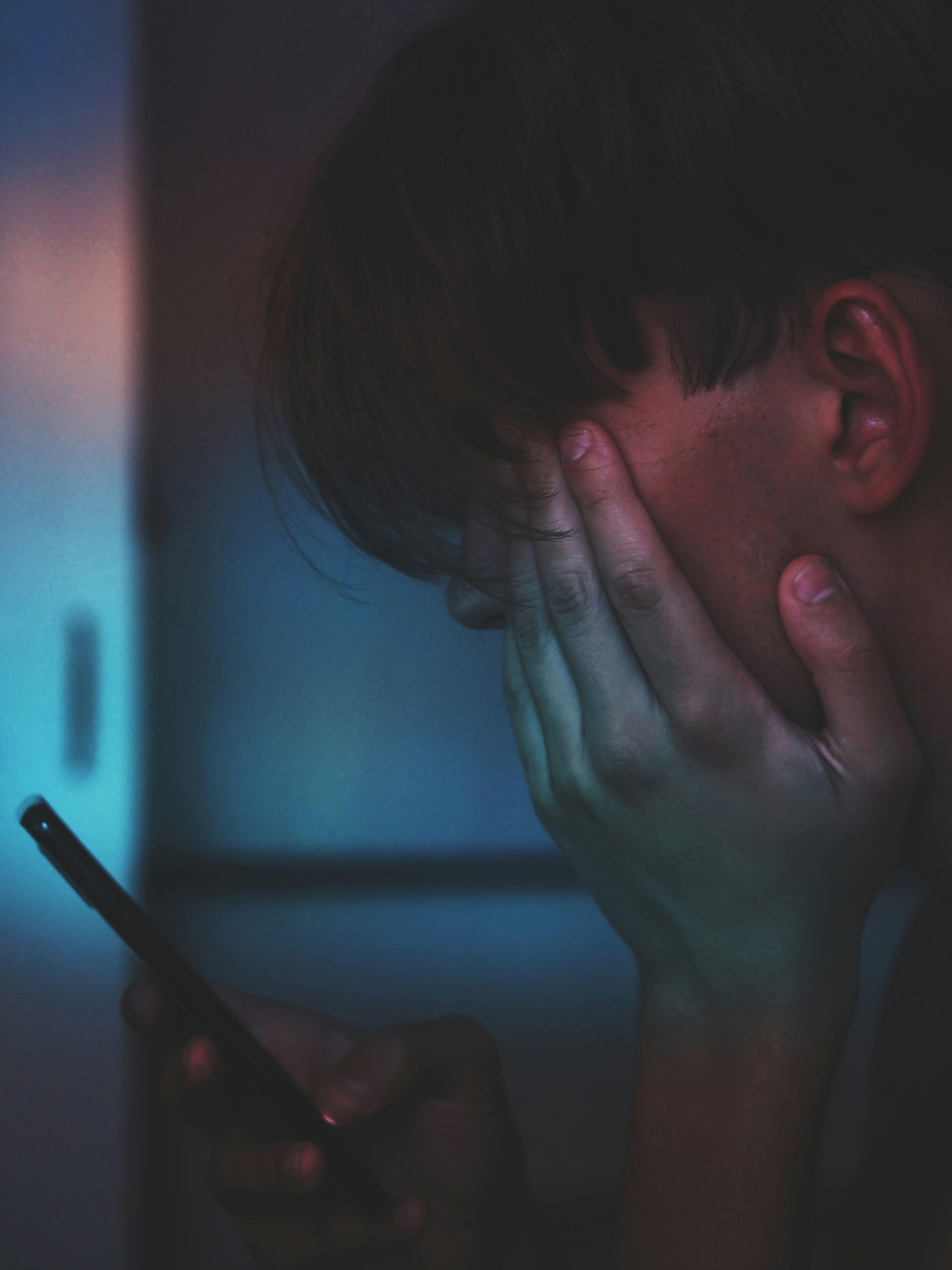 young man looking at phone