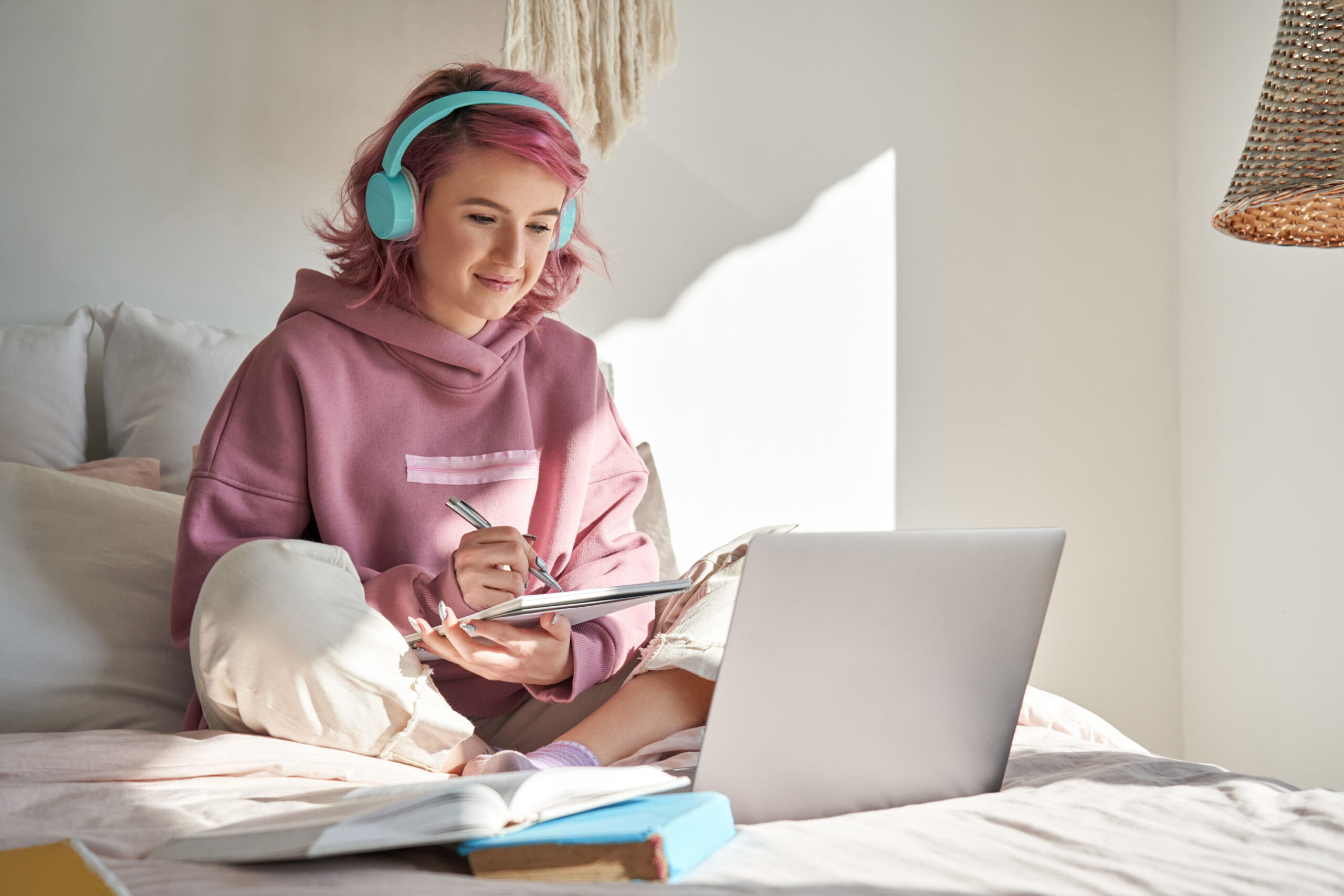 photo of teenager using laptop in an article about the online safety act