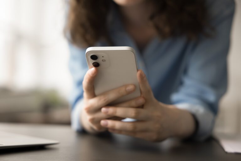 a person using a phone in a photo embedded into an article on dating in the digital age