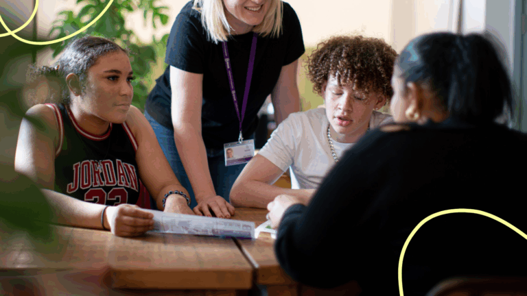 Teacher delivering an RSHE lesson to three students