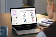 Teacher sat at a laptop looking at a screen showing a lesson powerpoint presentation