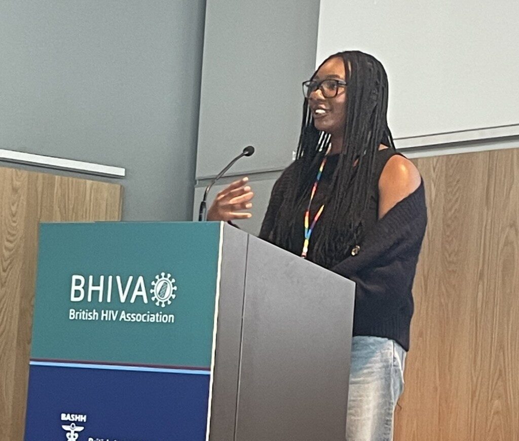 Nikki delivering a speech at a conference