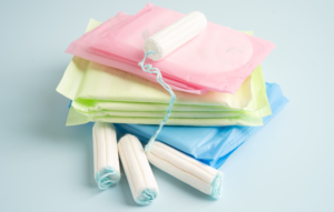 period pads and tampons in a pile