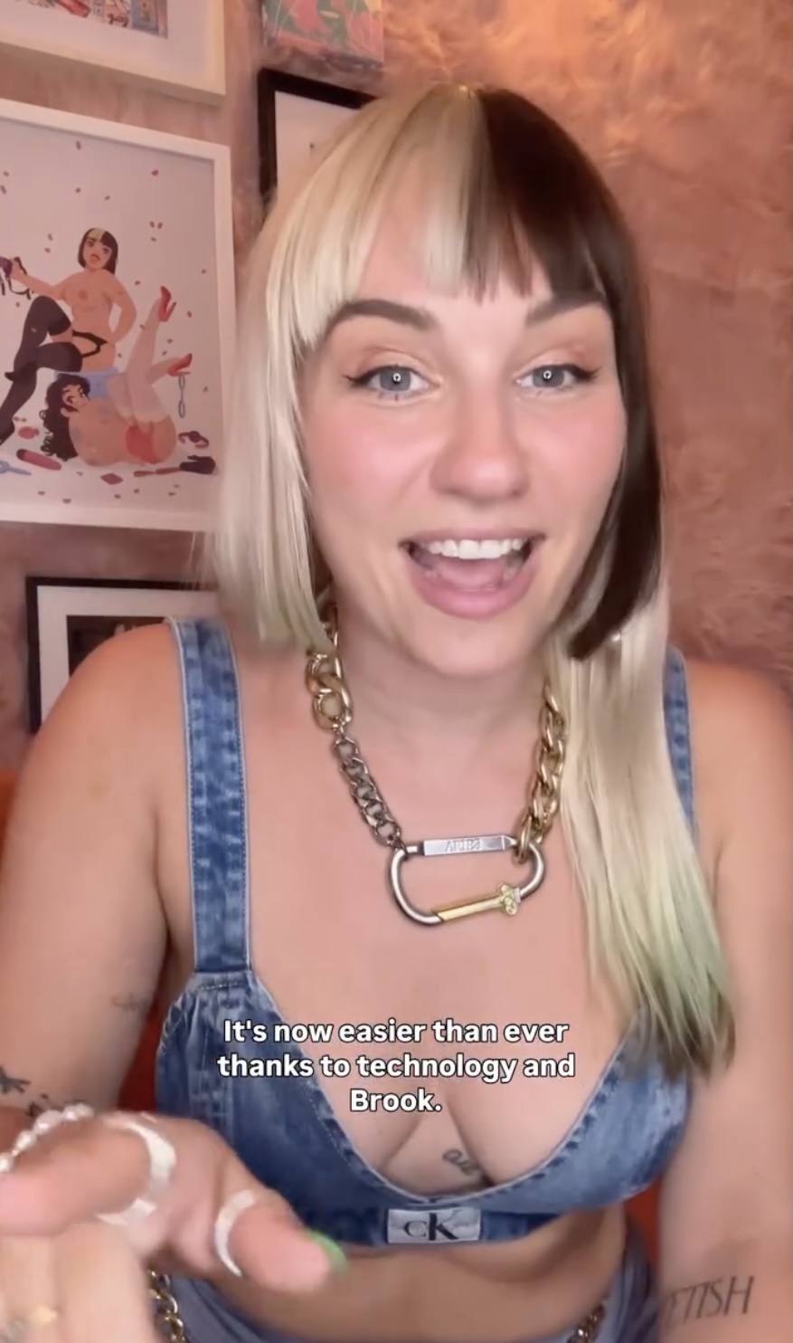 Reed amber wearing a denim shirt and carabiner chain necklace
