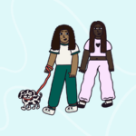 Two people walking a dog