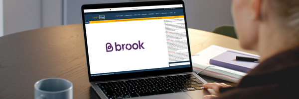 a laptop screen with a Brook webinar on it
